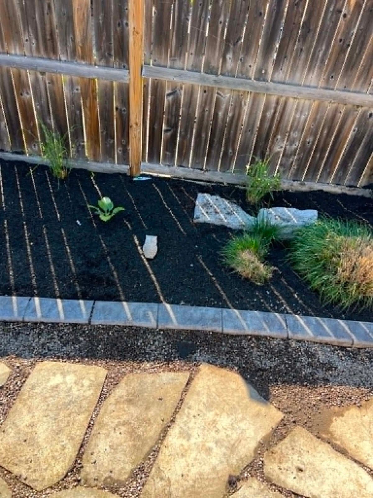 Mulch beds with natural stone borders